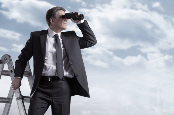 A 2021 Outlook Shows Business Man Standing on Ladder and Looking Through Binoculars.